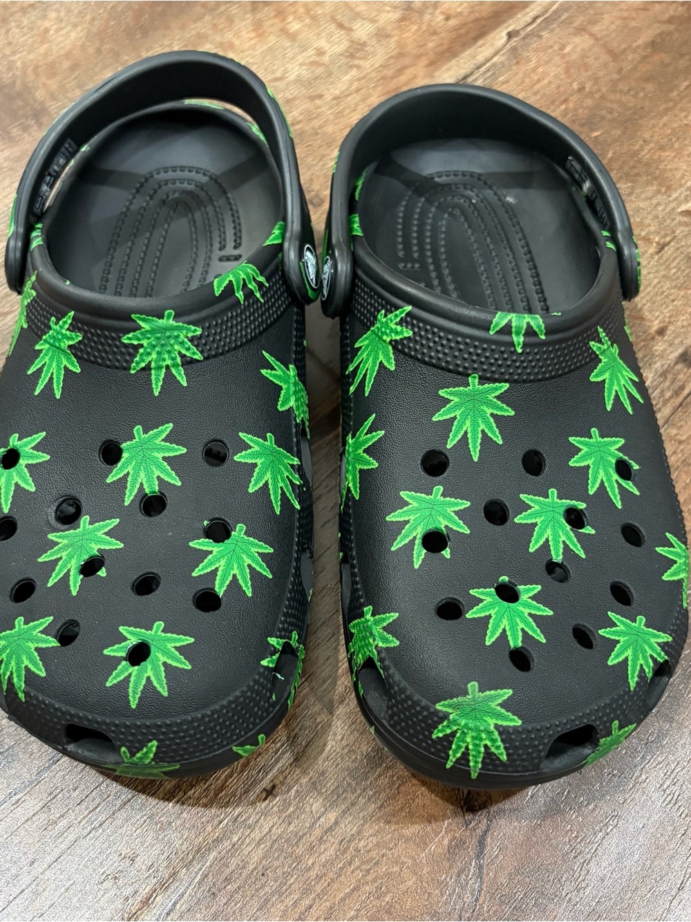 CROCS Kids Black Clogs with Bright Green Leaf Print
